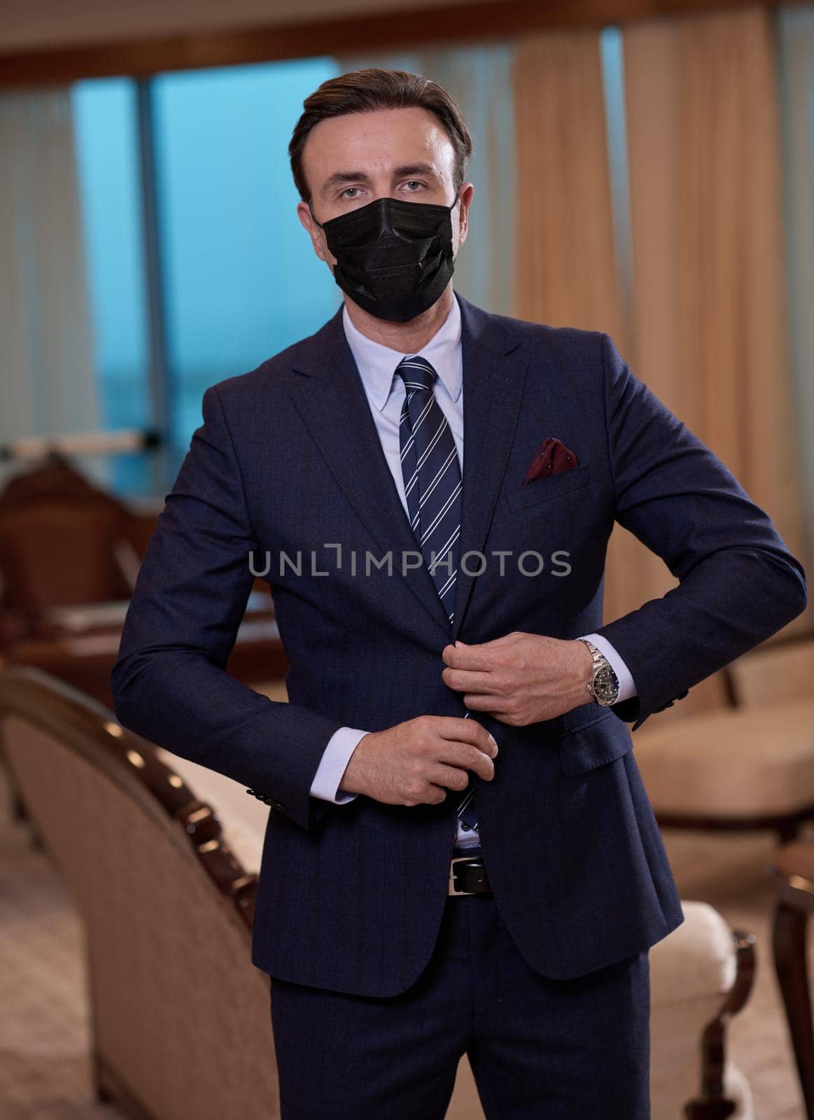 corporate business man wearing protective medical face mask at luxury office