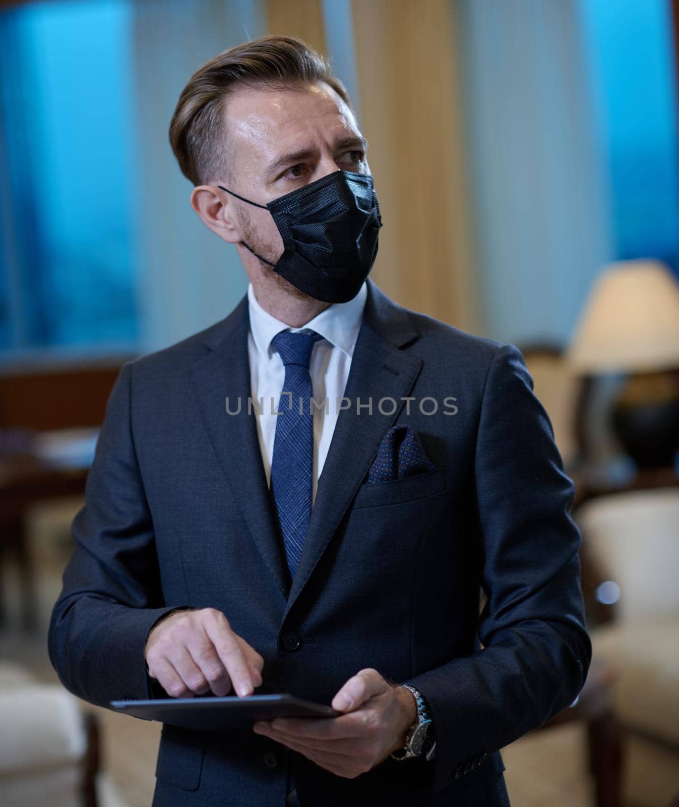 corporate business man wearing protective medical face mask at luxury office