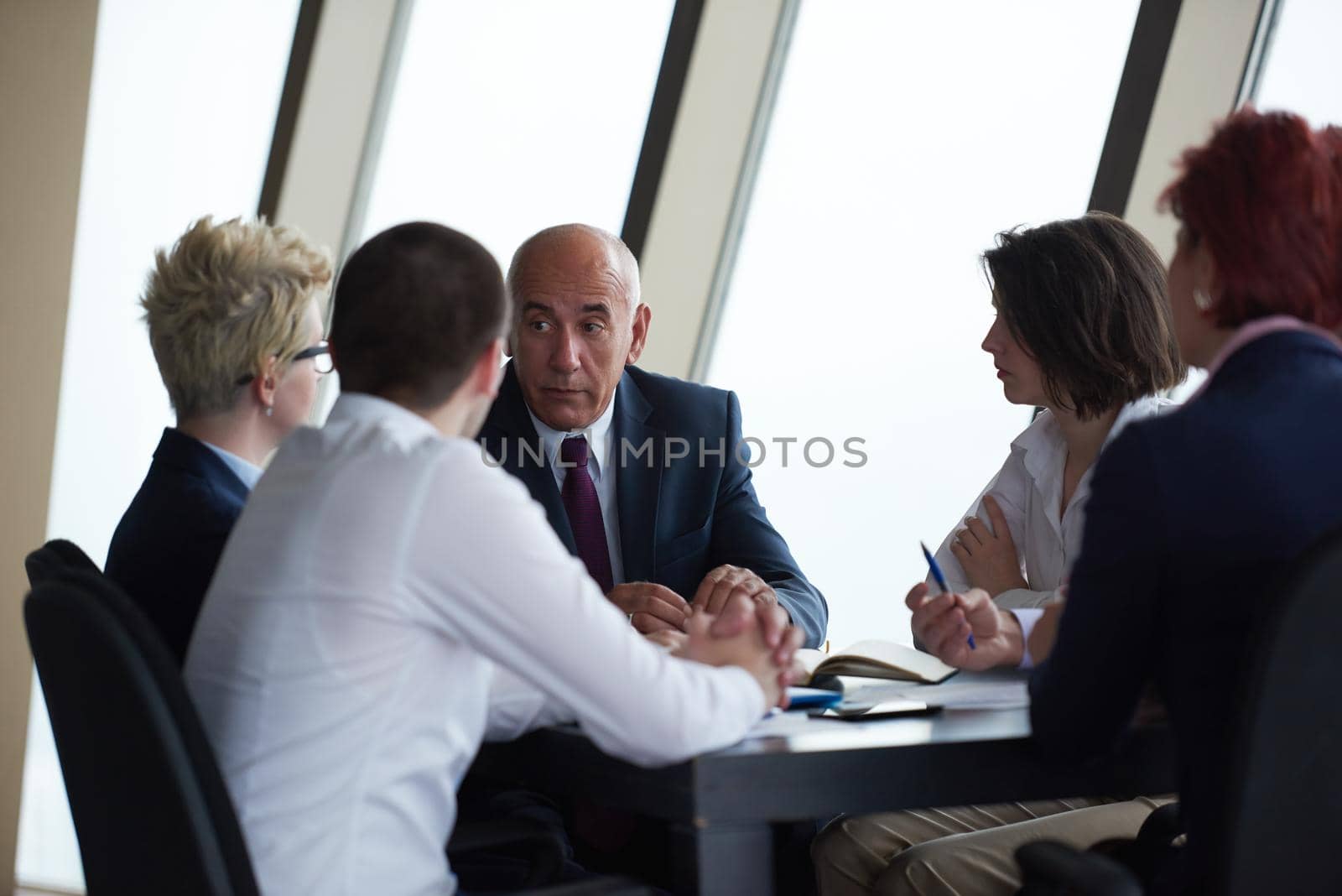 startup business people group have meeting in modern bright office interior, senoir investors  and young software  developers