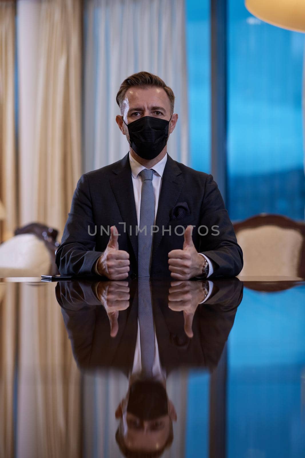 corporate business man wearing protective medical face mask at luxury office