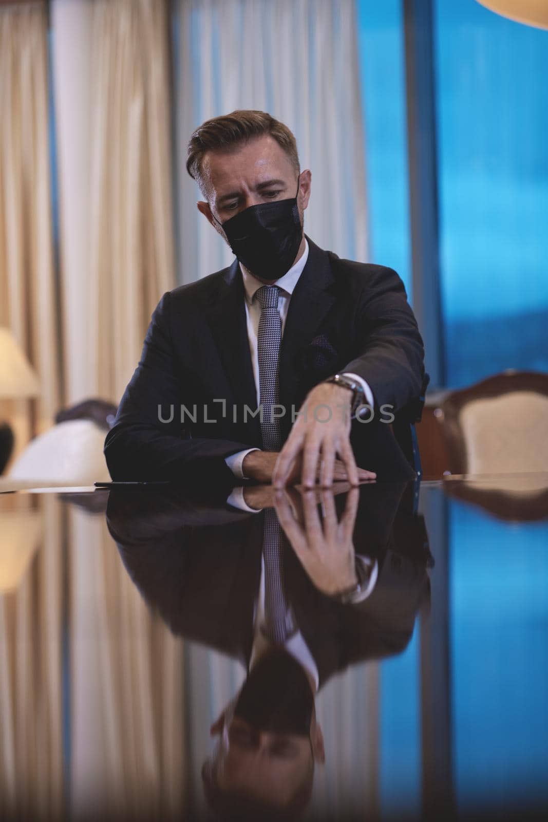 corporate business man wearing protective medical face mask at luxury office