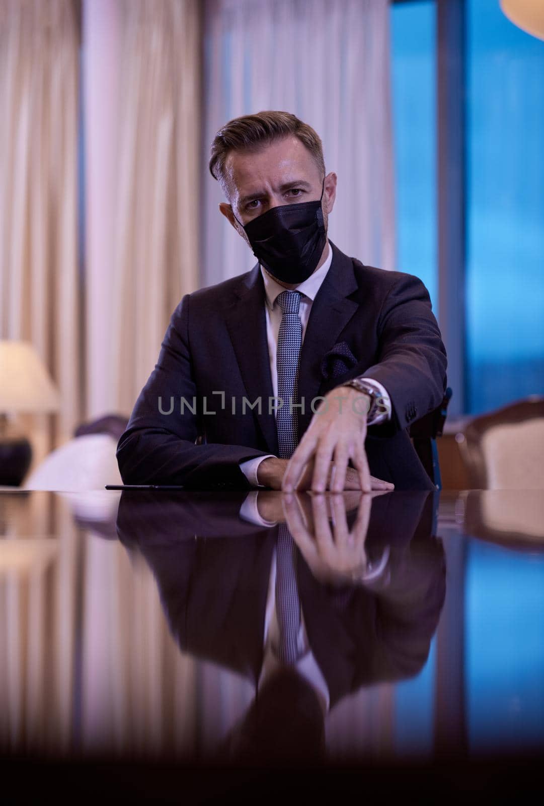 corporate business man wearing protective medical face mask at luxury office