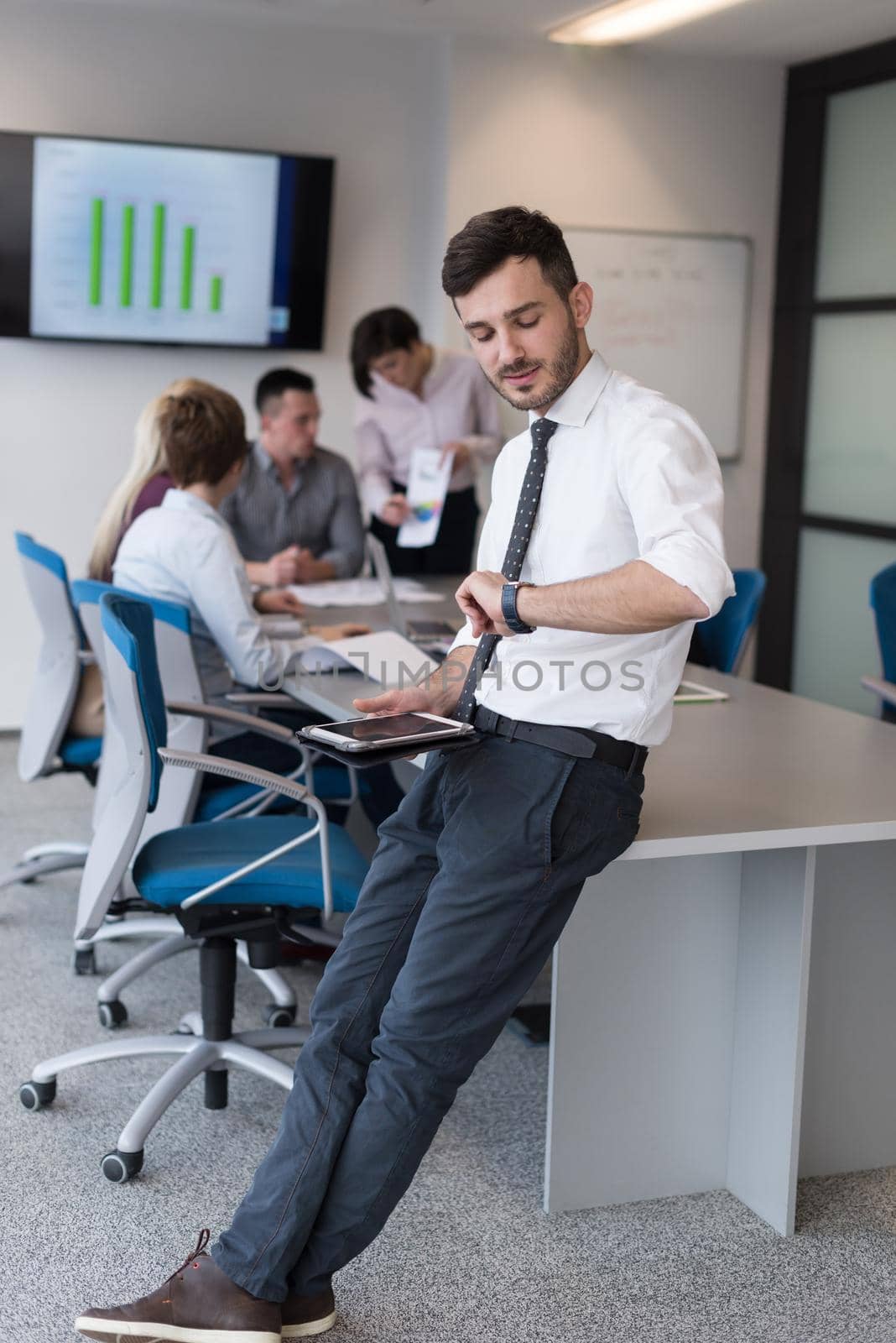 young business man with tablet at office meeting room by dotshock