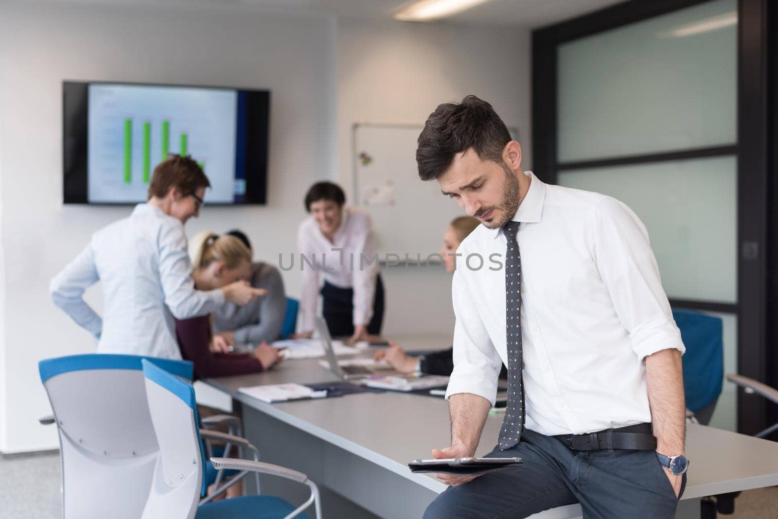 young business man with tablet at office meeting room by dotshock