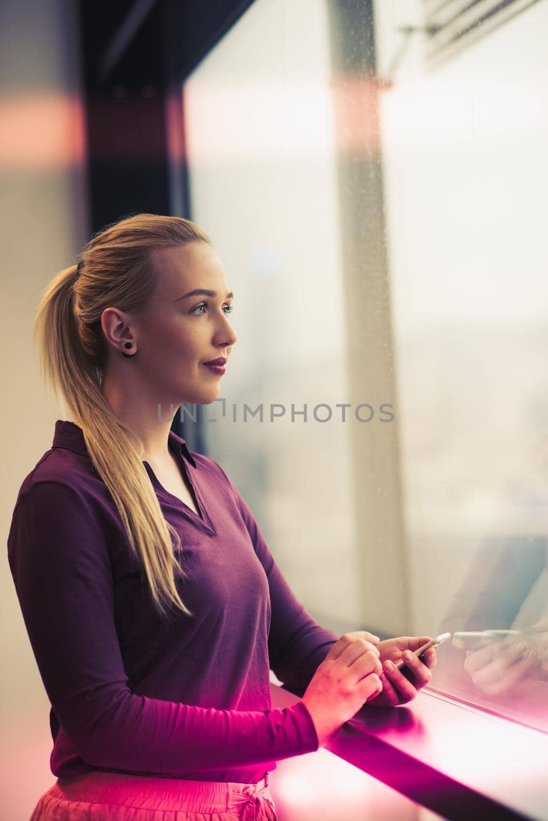 business woman at office using smart phone to check internet and type messages