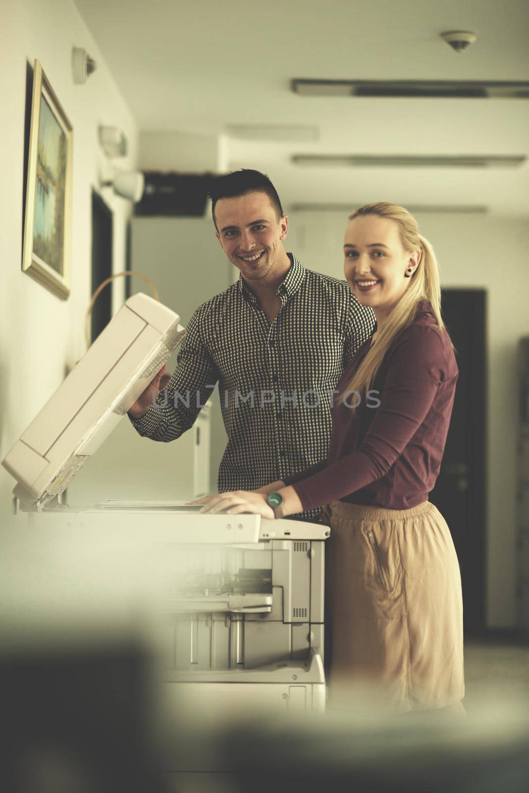 happy business people group at modern office copy  documents on machine
