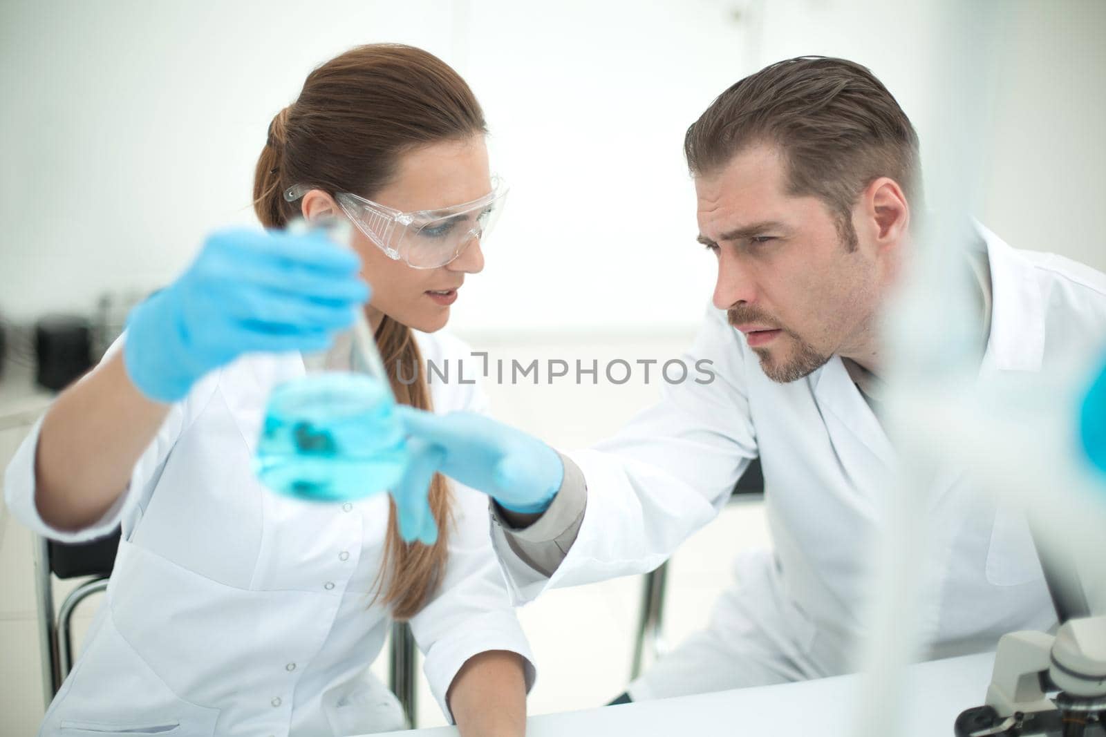 Two scientists are working in laboratory.science and health