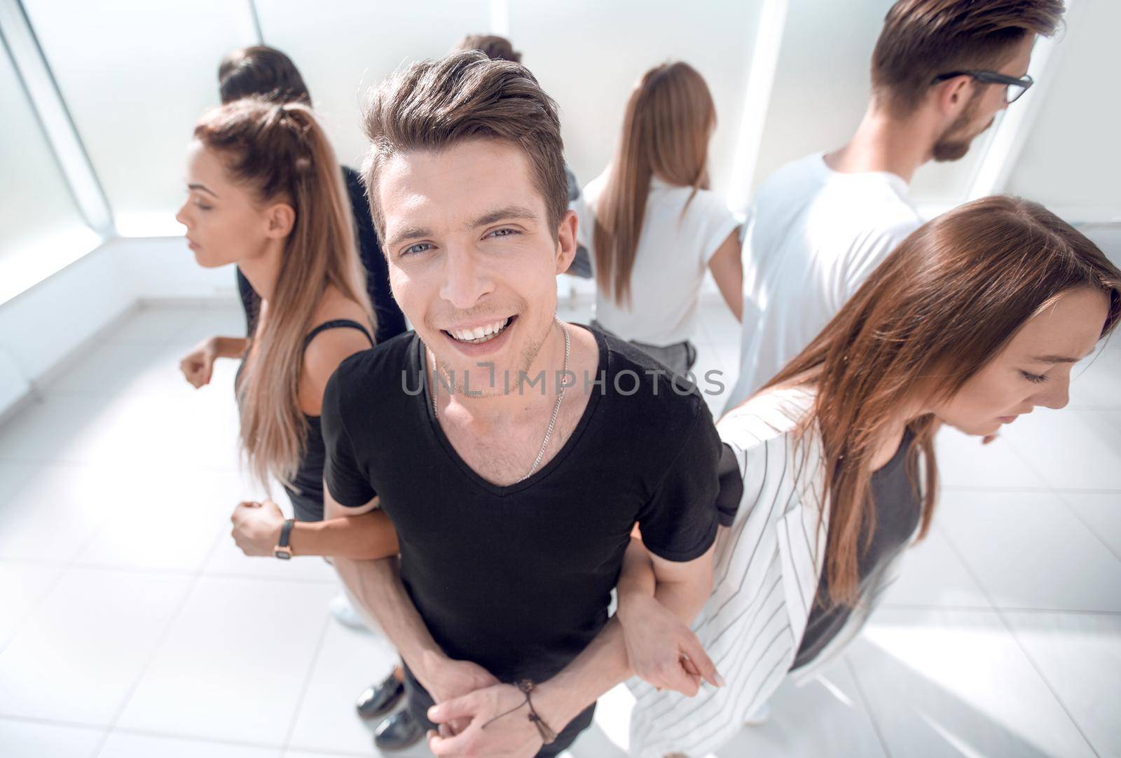 guy standing in a circle with his team .the concept of team building