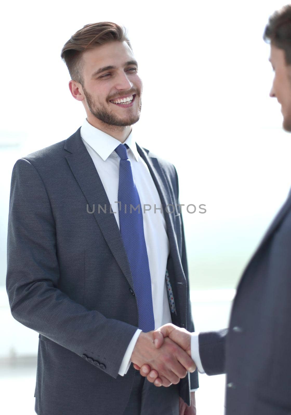 smiling business partners shaking hands.concept of cooperation