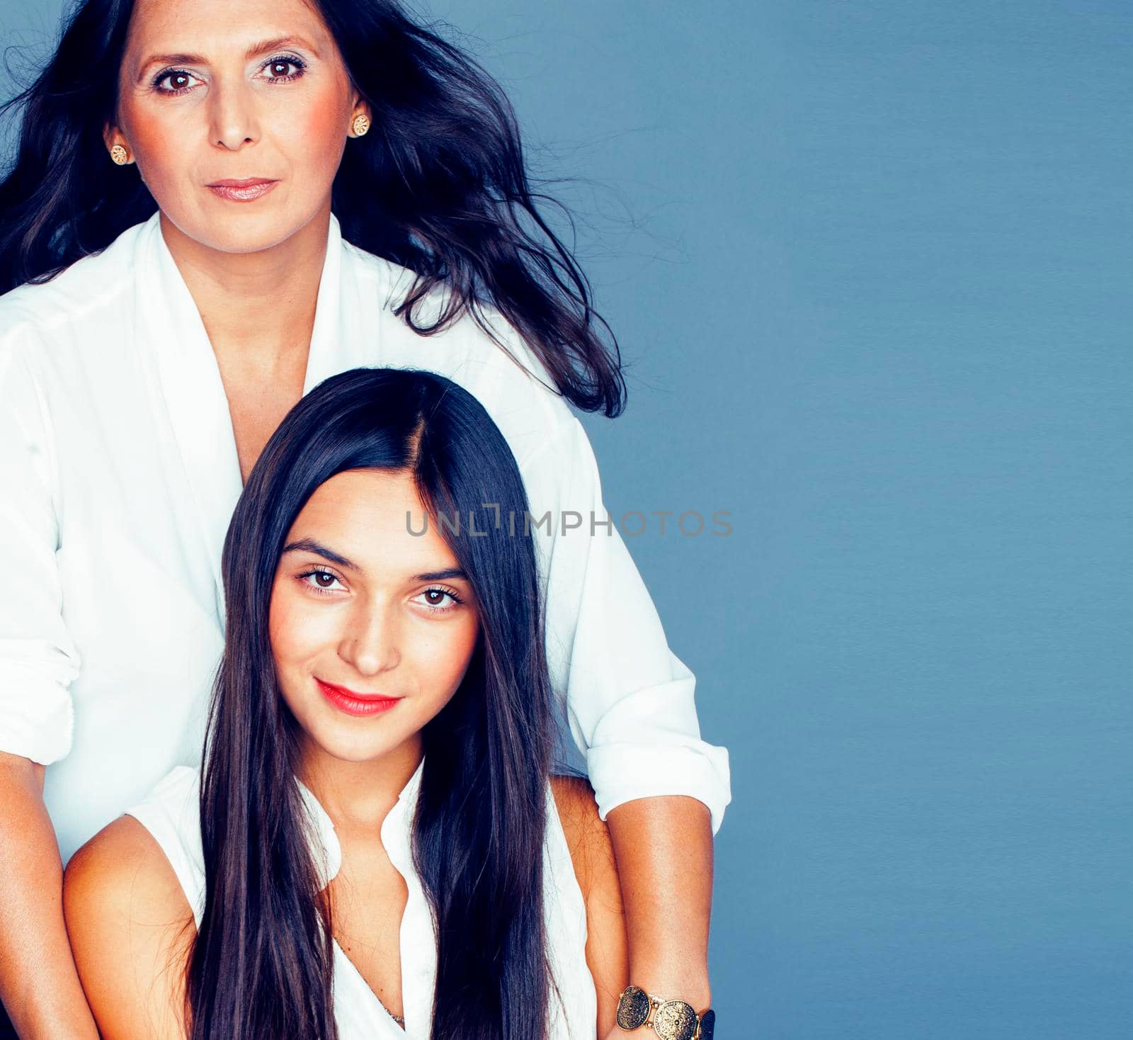 cute pretty teen daughter with mature mother hugging, fashion style brunette, lifestyle people concept by JordanJ