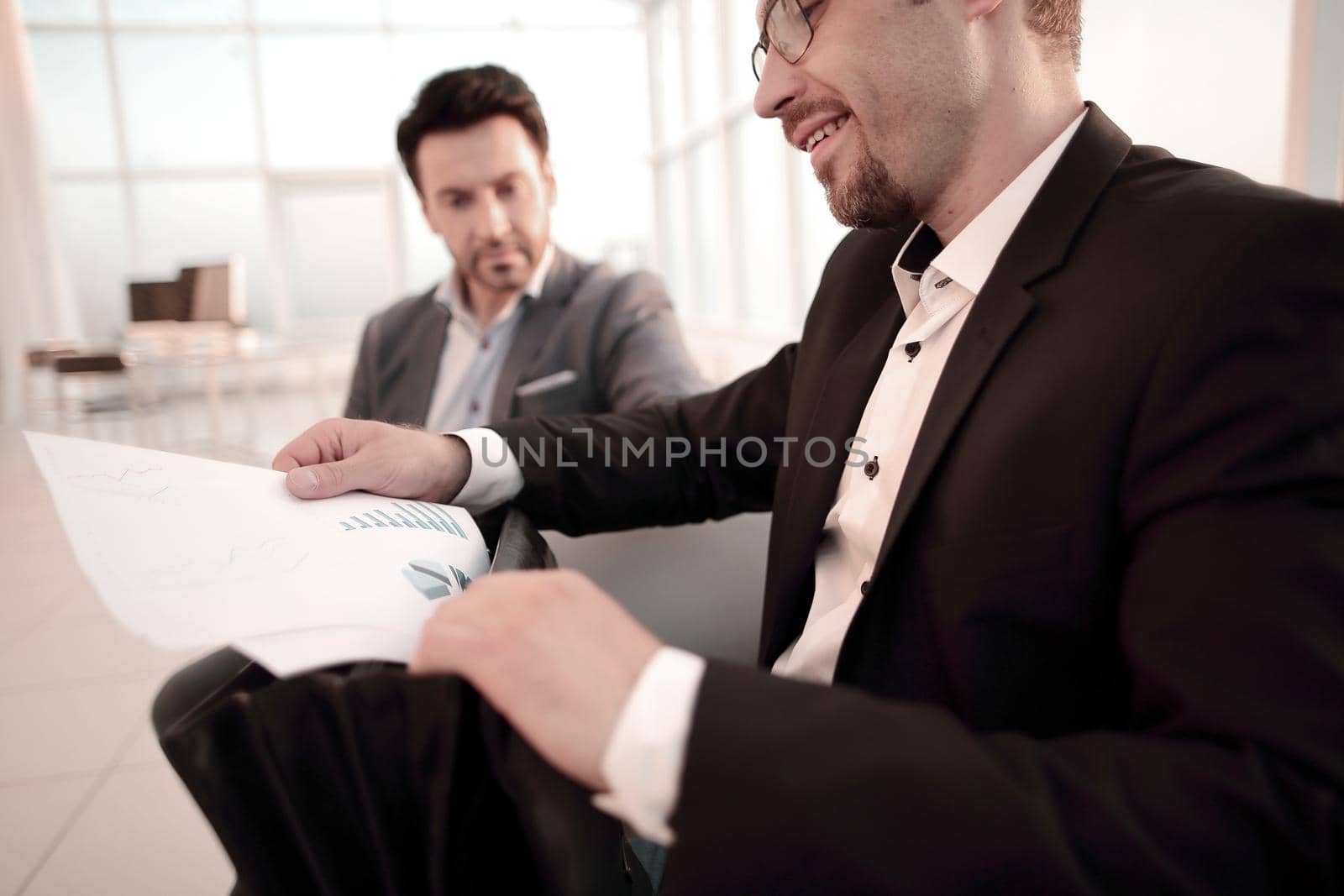 close up.the businessman looks at the financial report.business concept