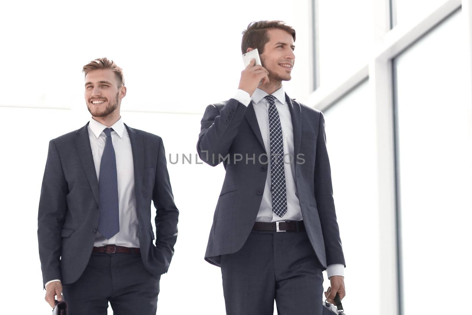 young businessman goes through the office corridor.photo with copy space