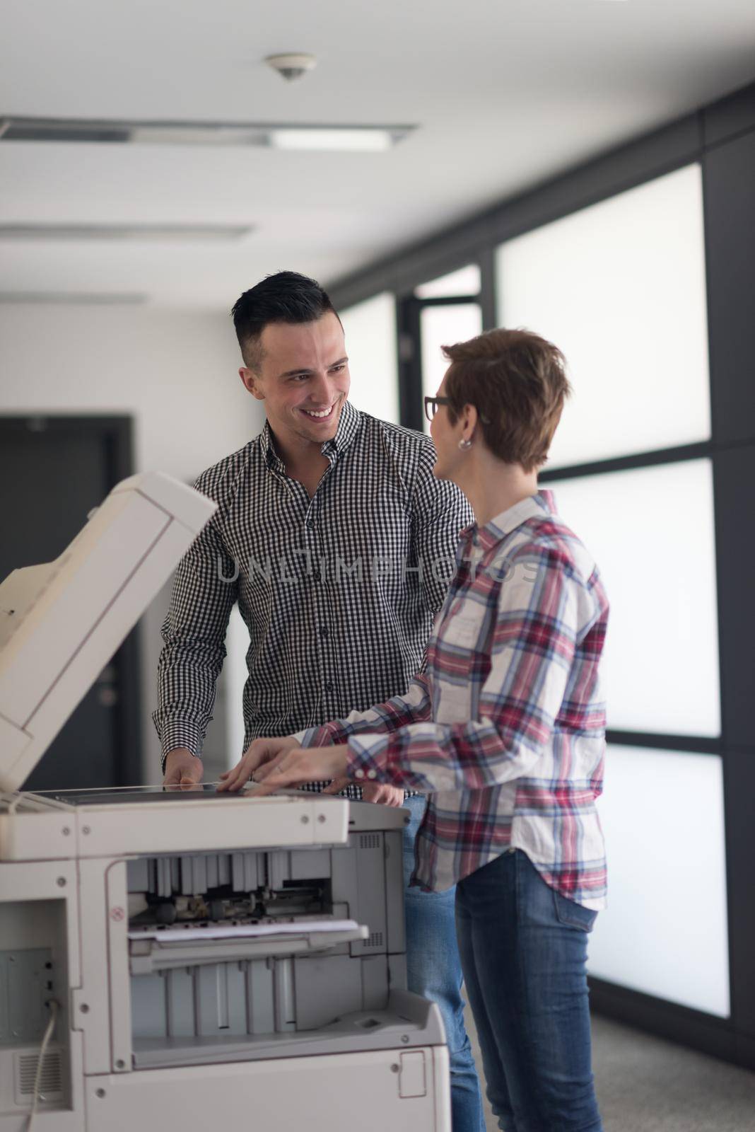happy business people group at modern office copy  documents on machine