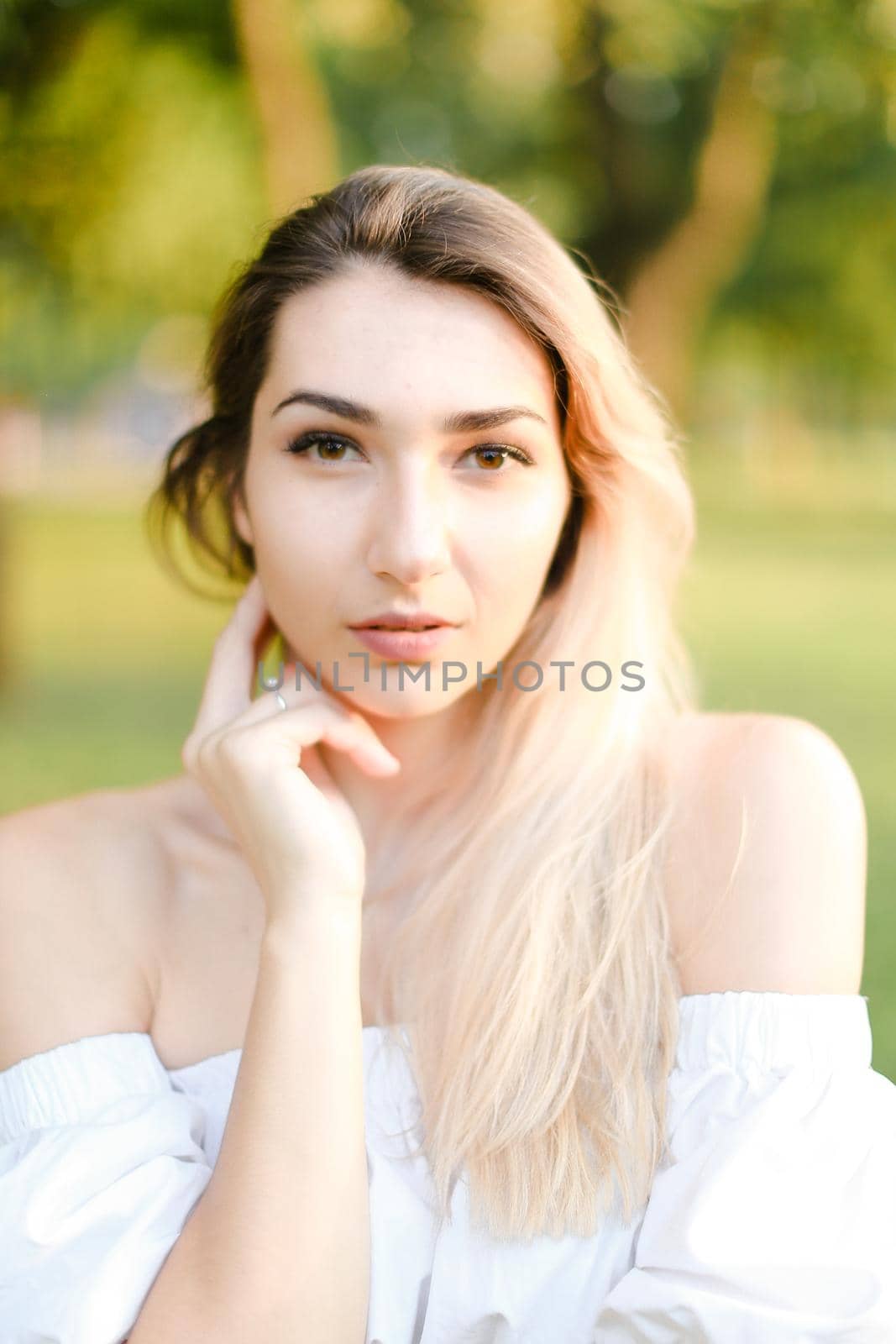 Portrait of young ukrainian girl, green background. Concept of beauty and everyday makeup.