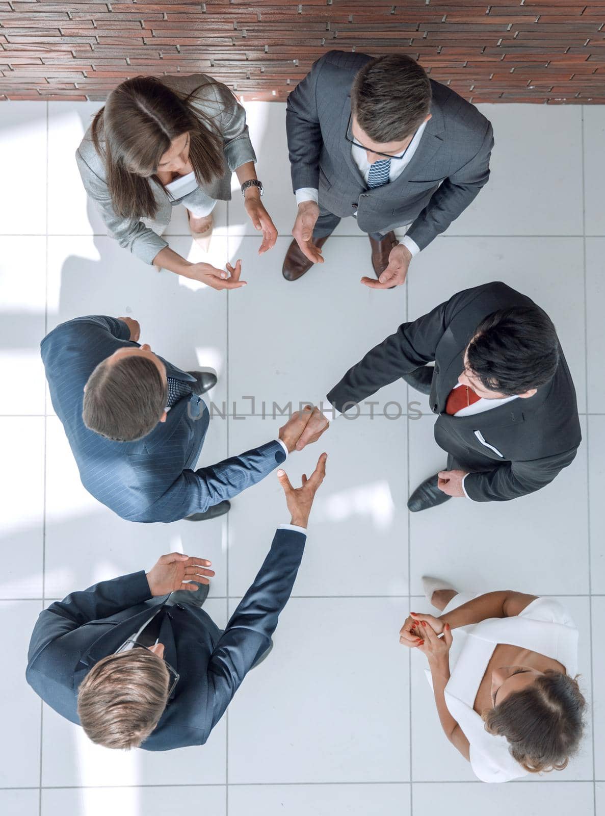 top view.business partners shaking hands.business concept