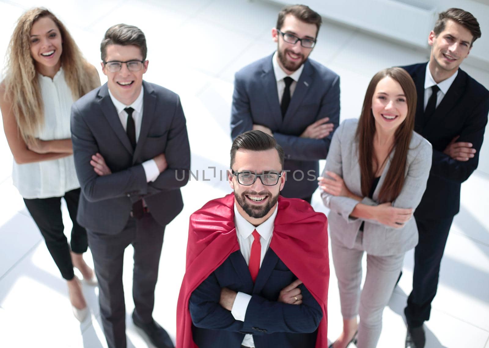 top view.businessman superhero and his business team looking at the camera.business concept