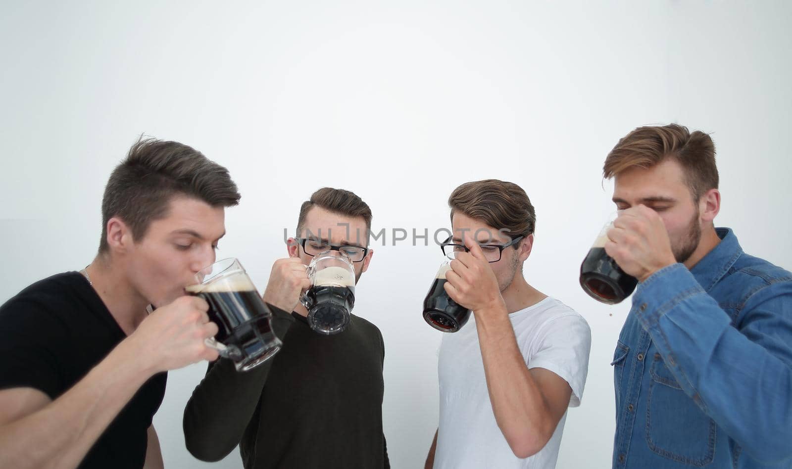 Beautiful guys drink beer, resting