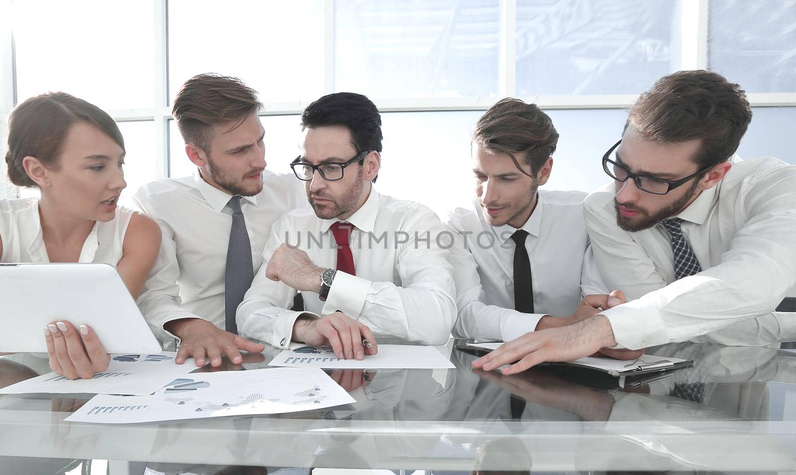business team using a digital tablet to work with financial data.business concept