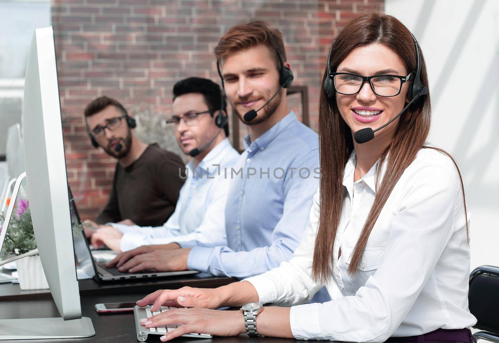 group of call center specialists work with clients .photo with copy space