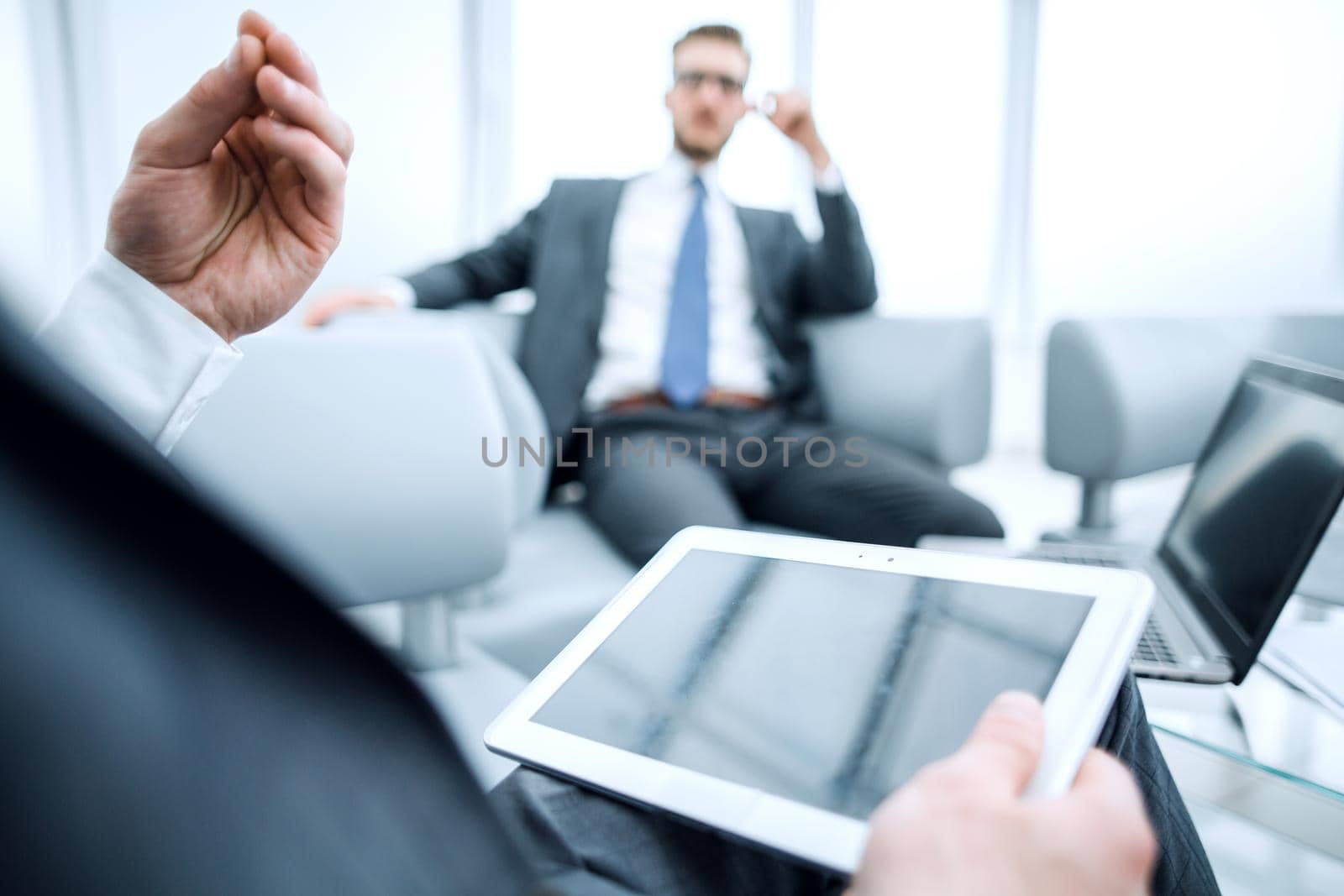 business background.businessman with digital tablet on office background.people and technology