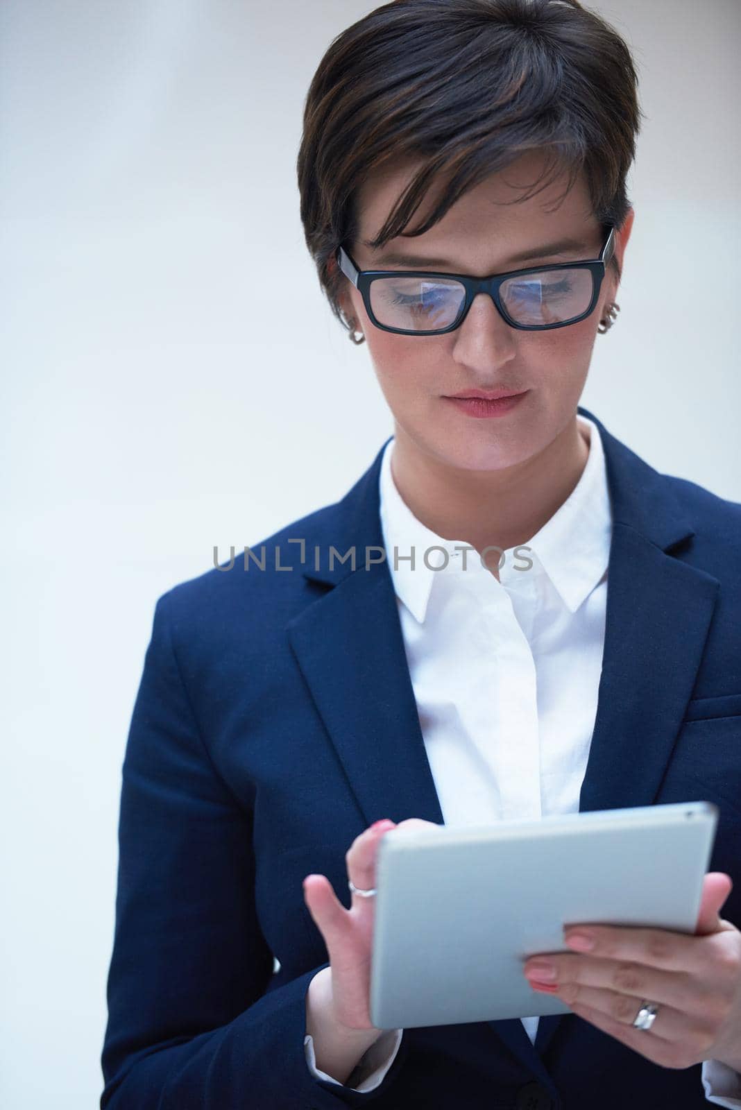 corporate business woman working on tablet computer  at modern office interior