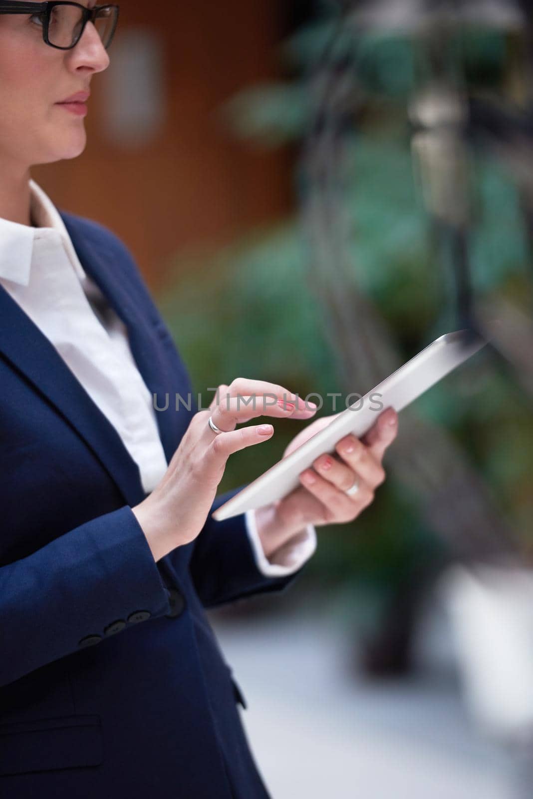 corporate business woman working on tablet computer  at modern office interior