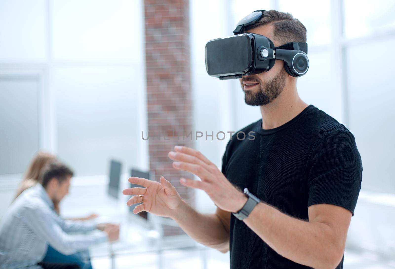 Hipster on confident face driving car in virtual reality with modern digital gadget.