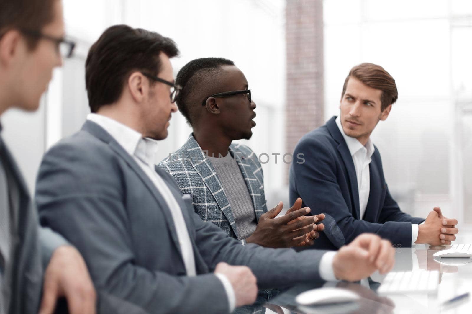 close up. multinational business team sitting at the Desk.the concept of teamwork