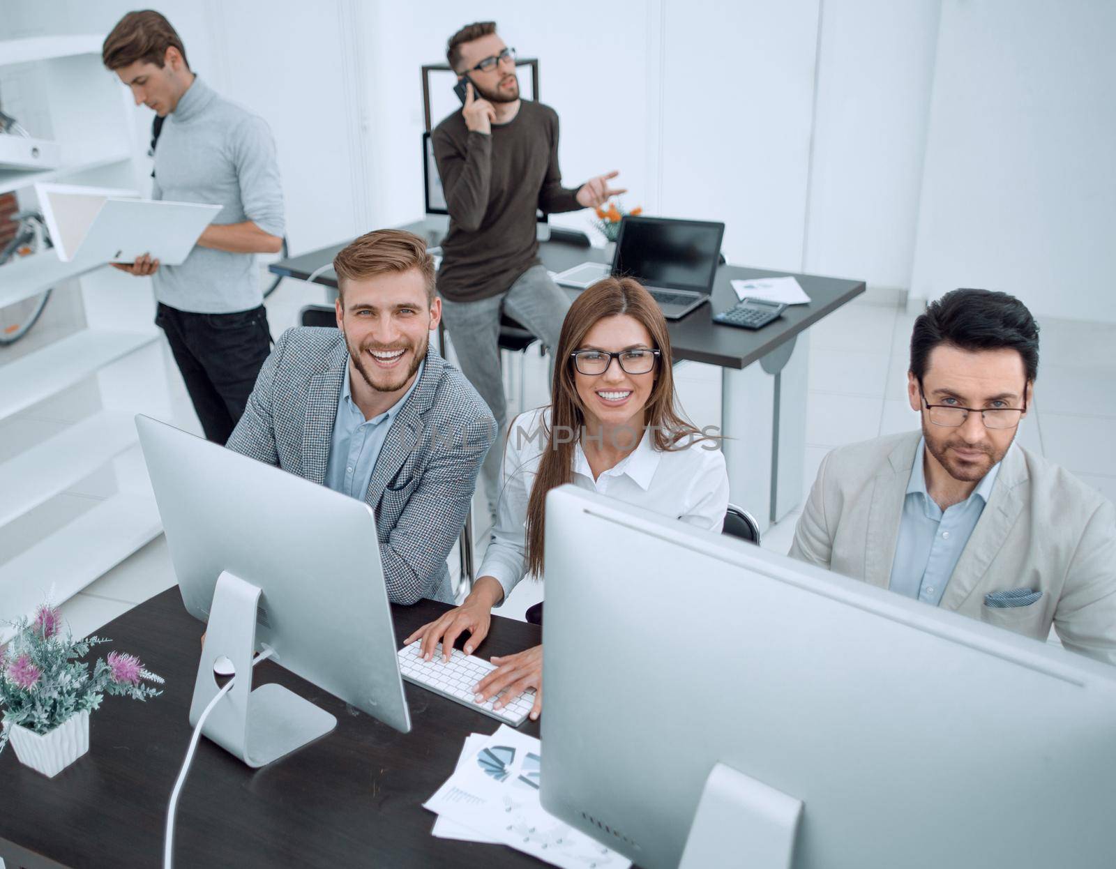 top view.professional business team sitting at the Desk.business concept
