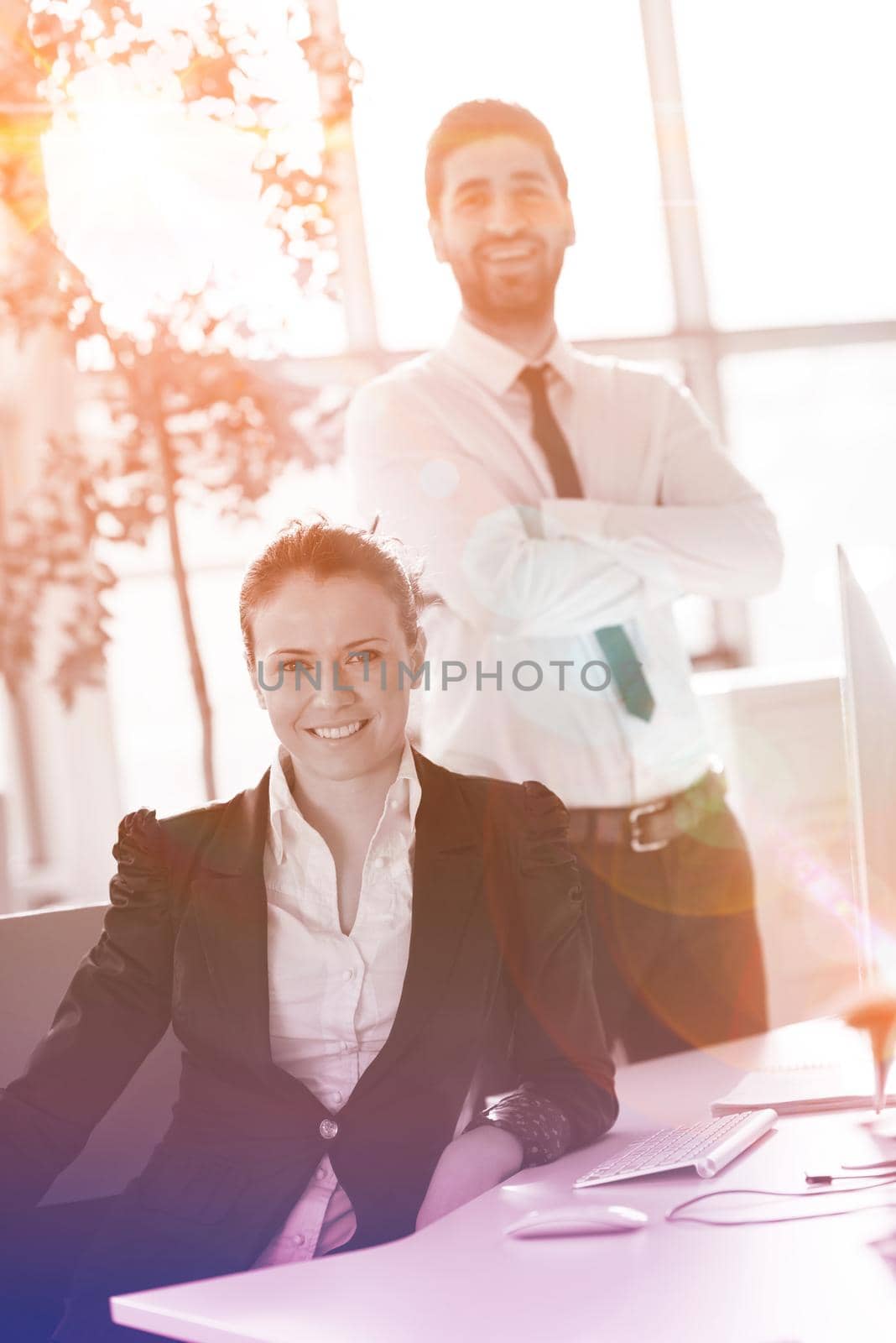 business couple working together on project, sunrise in background by dotshock