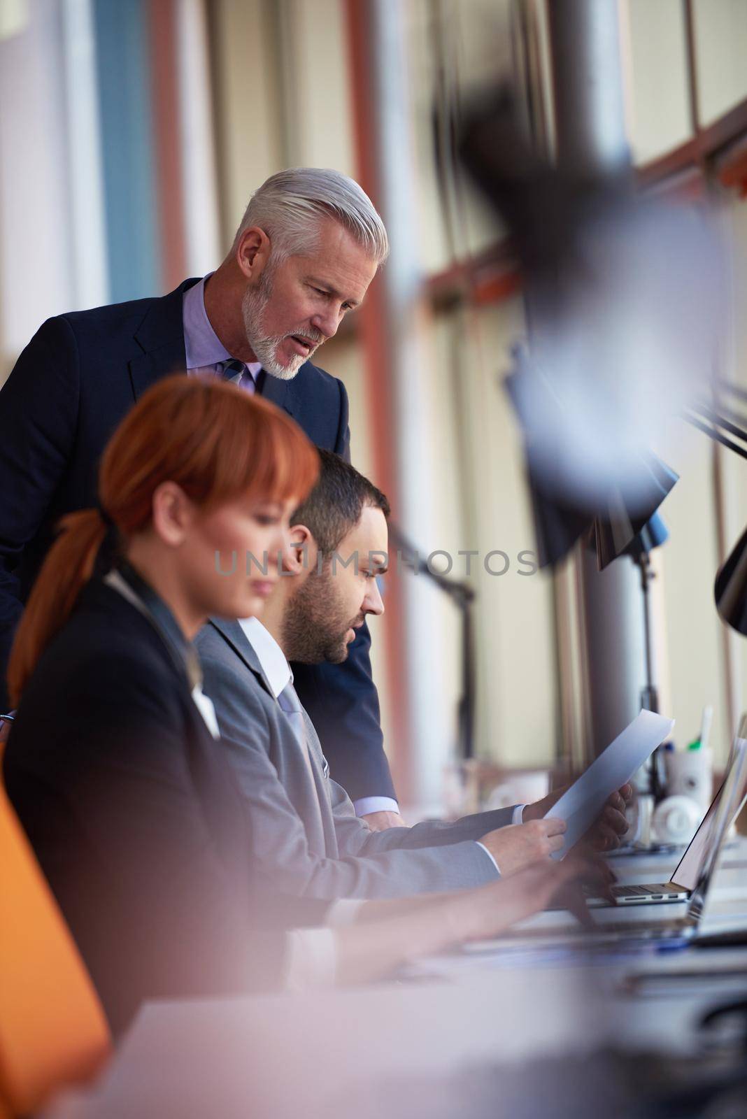 business people group with young adults and senior on meeting at modern bright office interior.