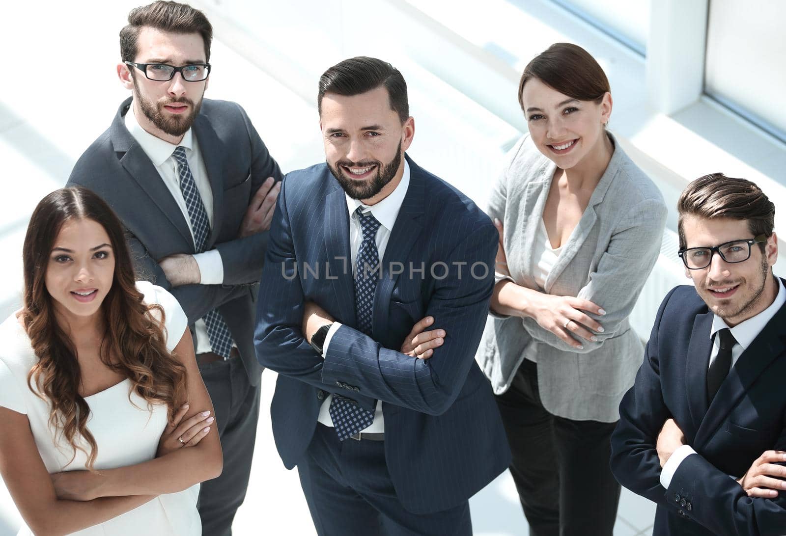 top view.happy business team showing their success winning concept