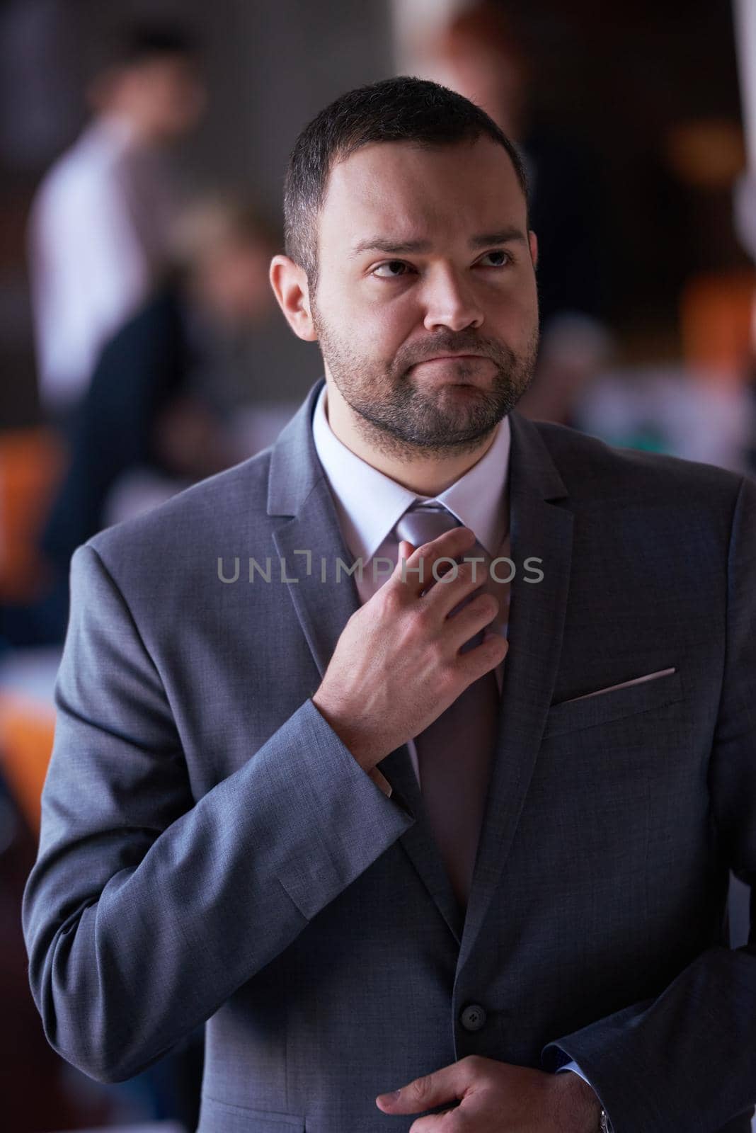 happy young business man portrait  at modern meeting office indoors