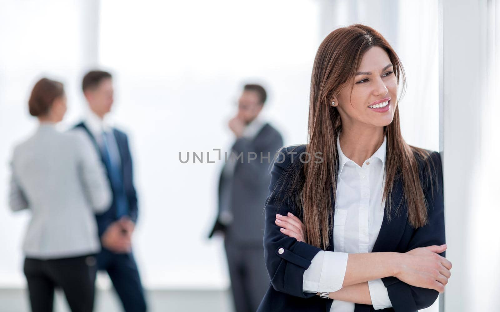 young business woman on blurred office background. by asdf