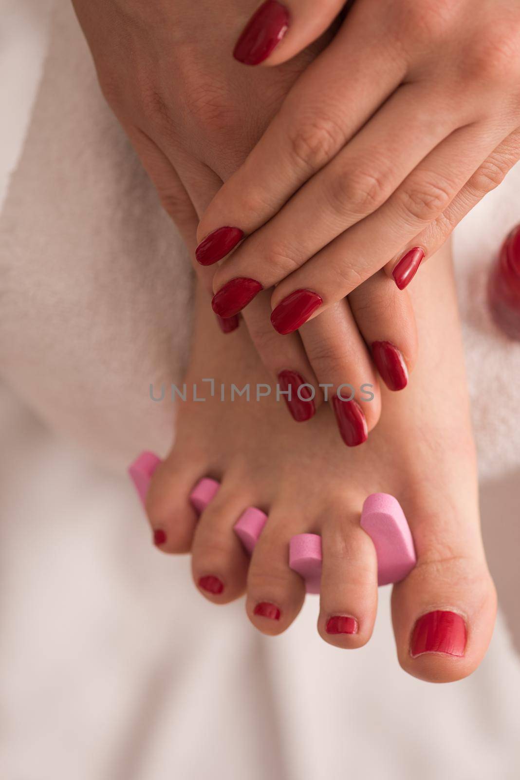 female feet and hands at spa salon by dotshock