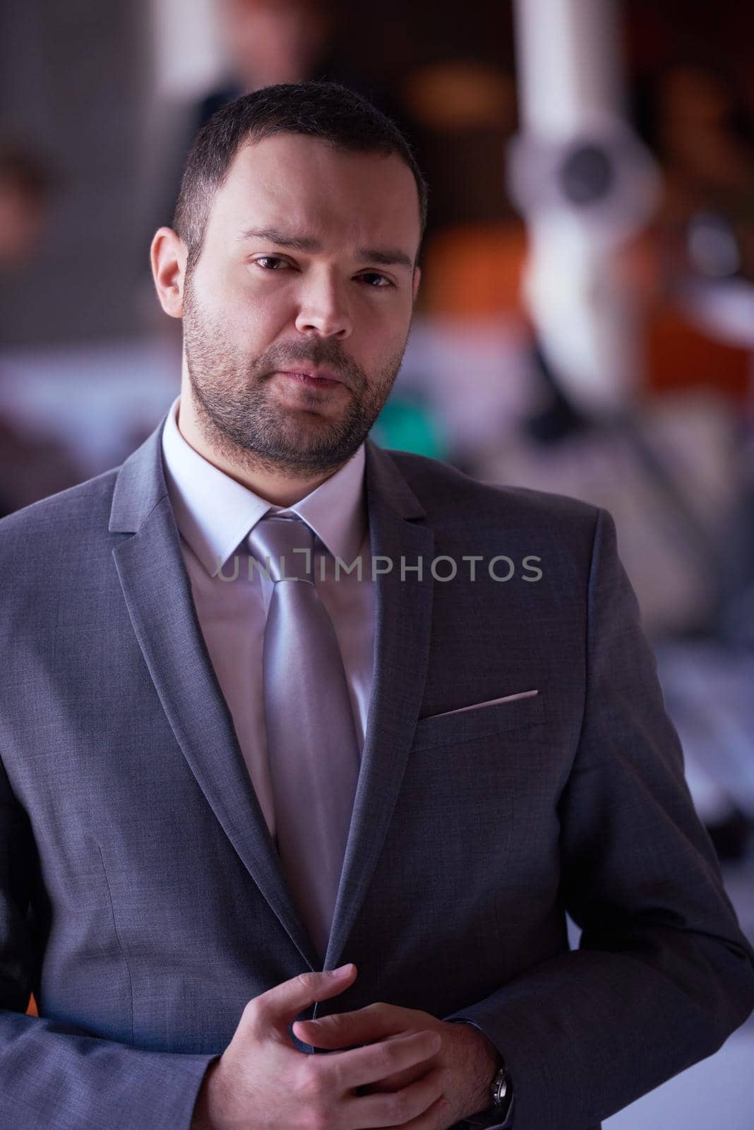 happy young business man portrait  at modern meeting office indoors