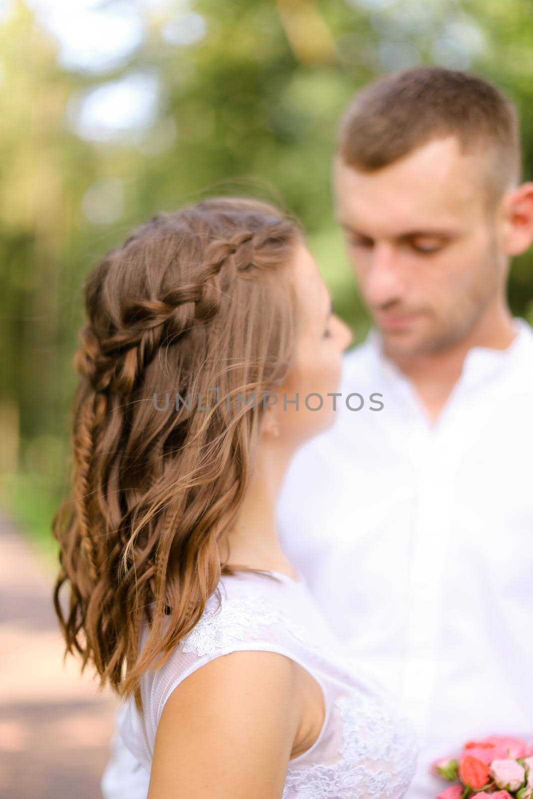 Happy handsome groom with caucasian bride. Concept of married couple and love.