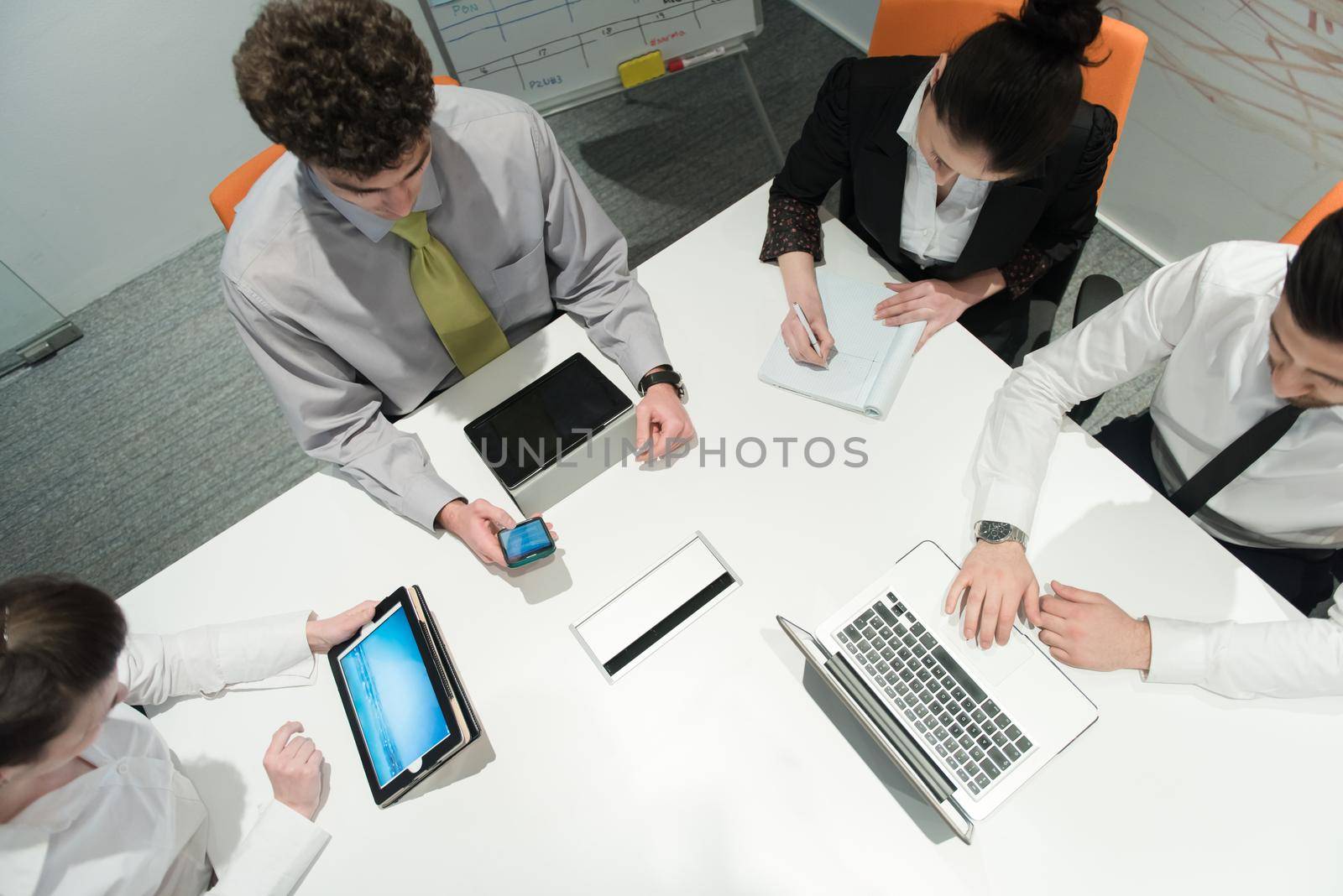 aerial view of business people group brainstorming on meeting by dotshock
