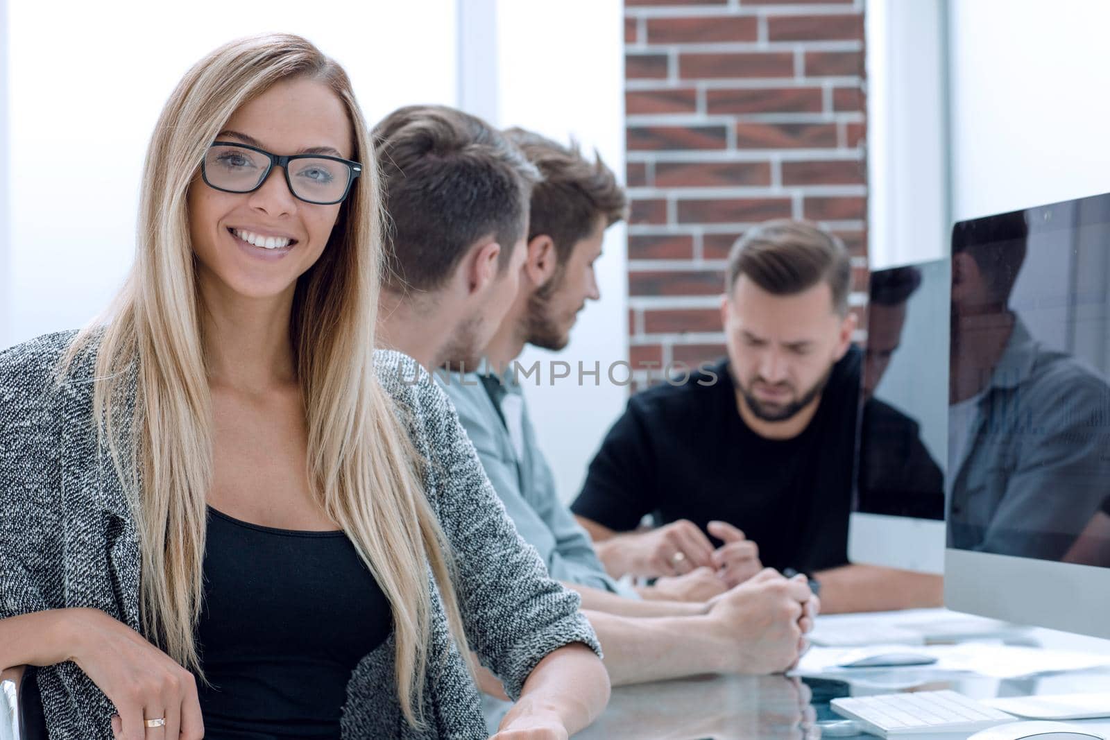 portrait, young professional, beautiful confident woman, smiling isolated indoors office background. Positive human emotions