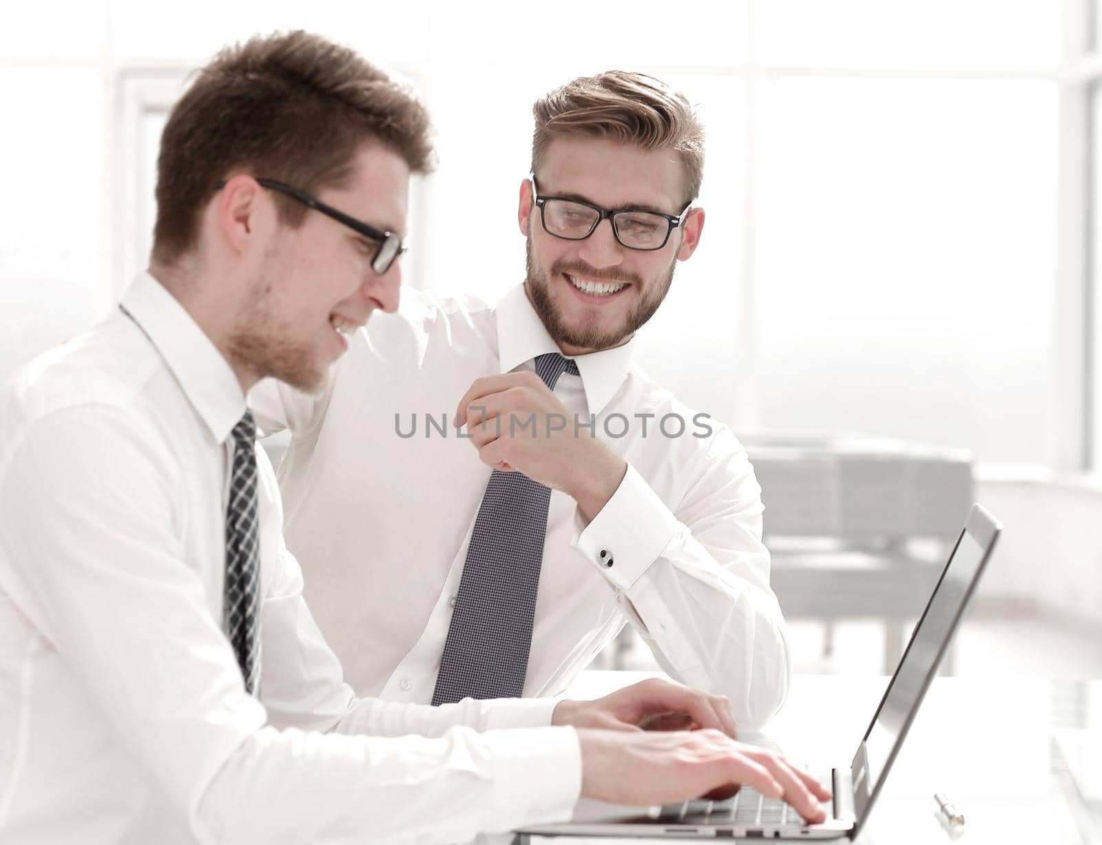 close up.employees working with a laptop in the office by asdf