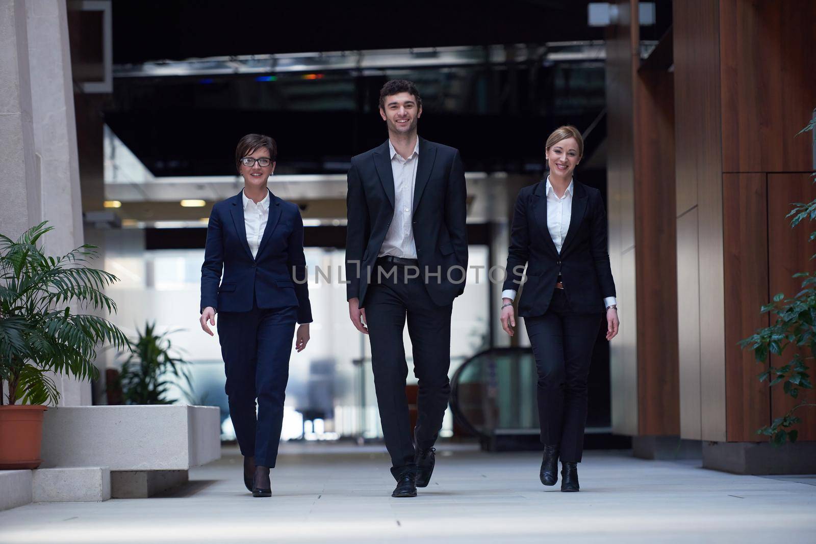 business people team walking by dotshock