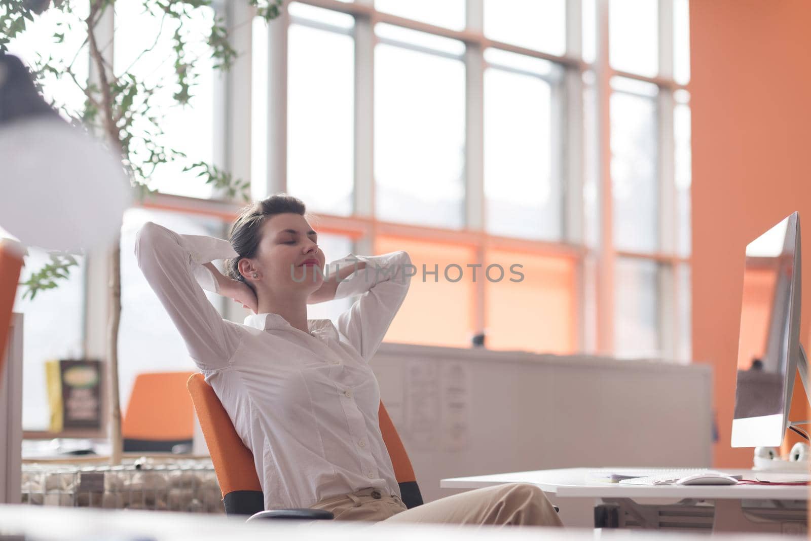 happy young business woman relaxing and geting insiration by dotshock