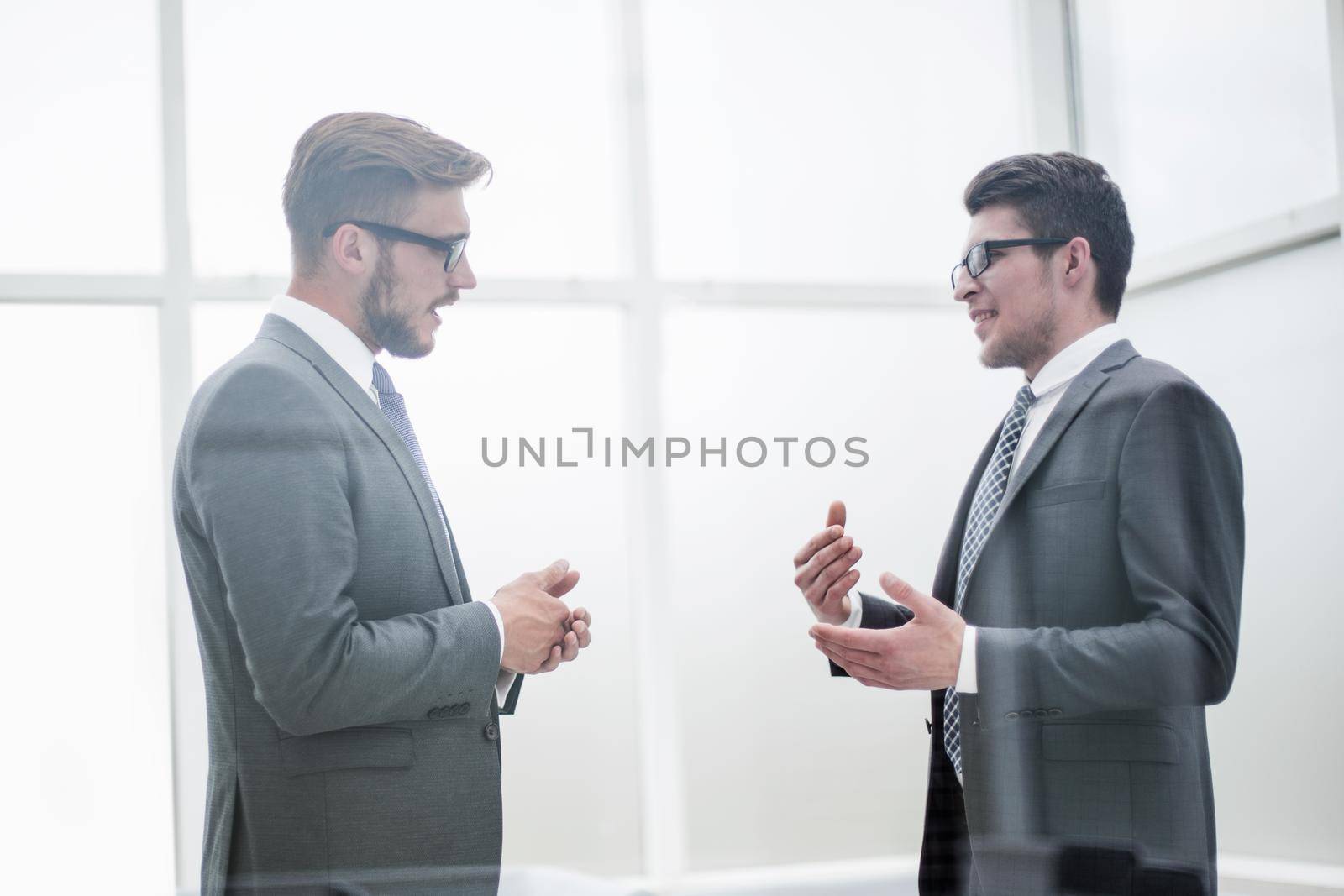 business partners talk in the office.double exposure