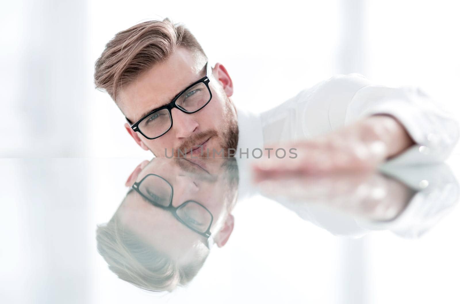 business background.businessman sitting at a glass table. by asdf