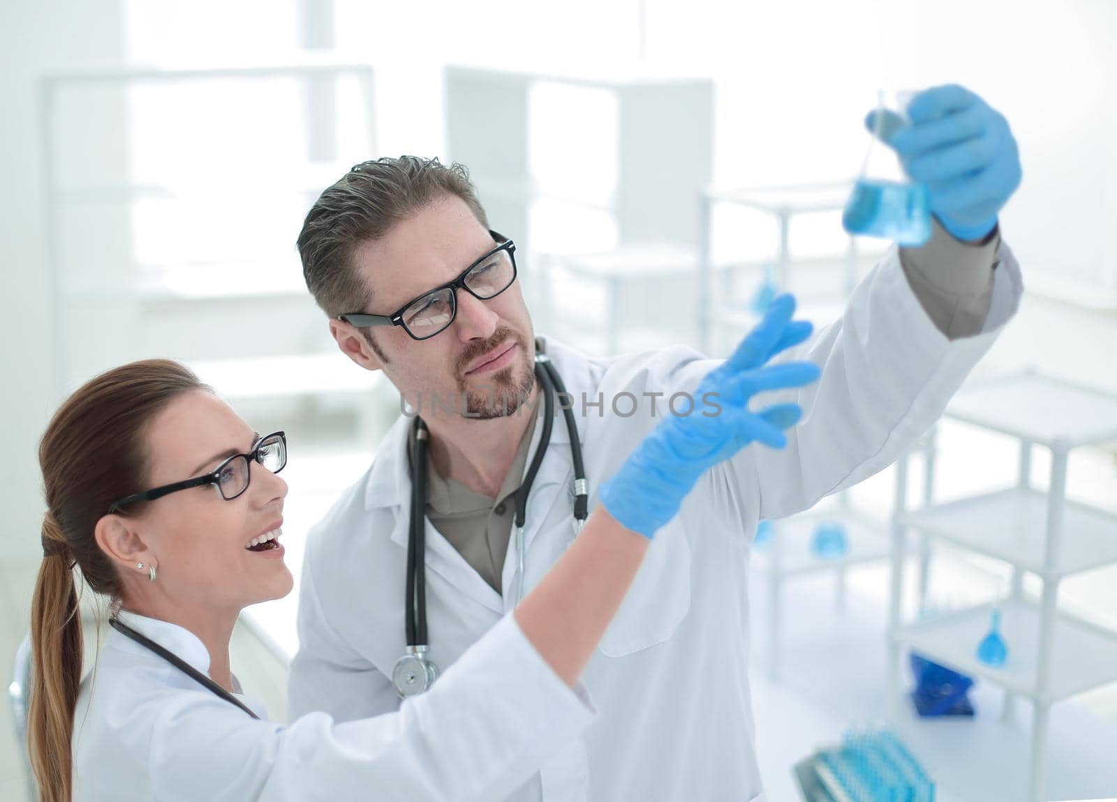 close up.researchers discuss the results, standing in the laboratory
