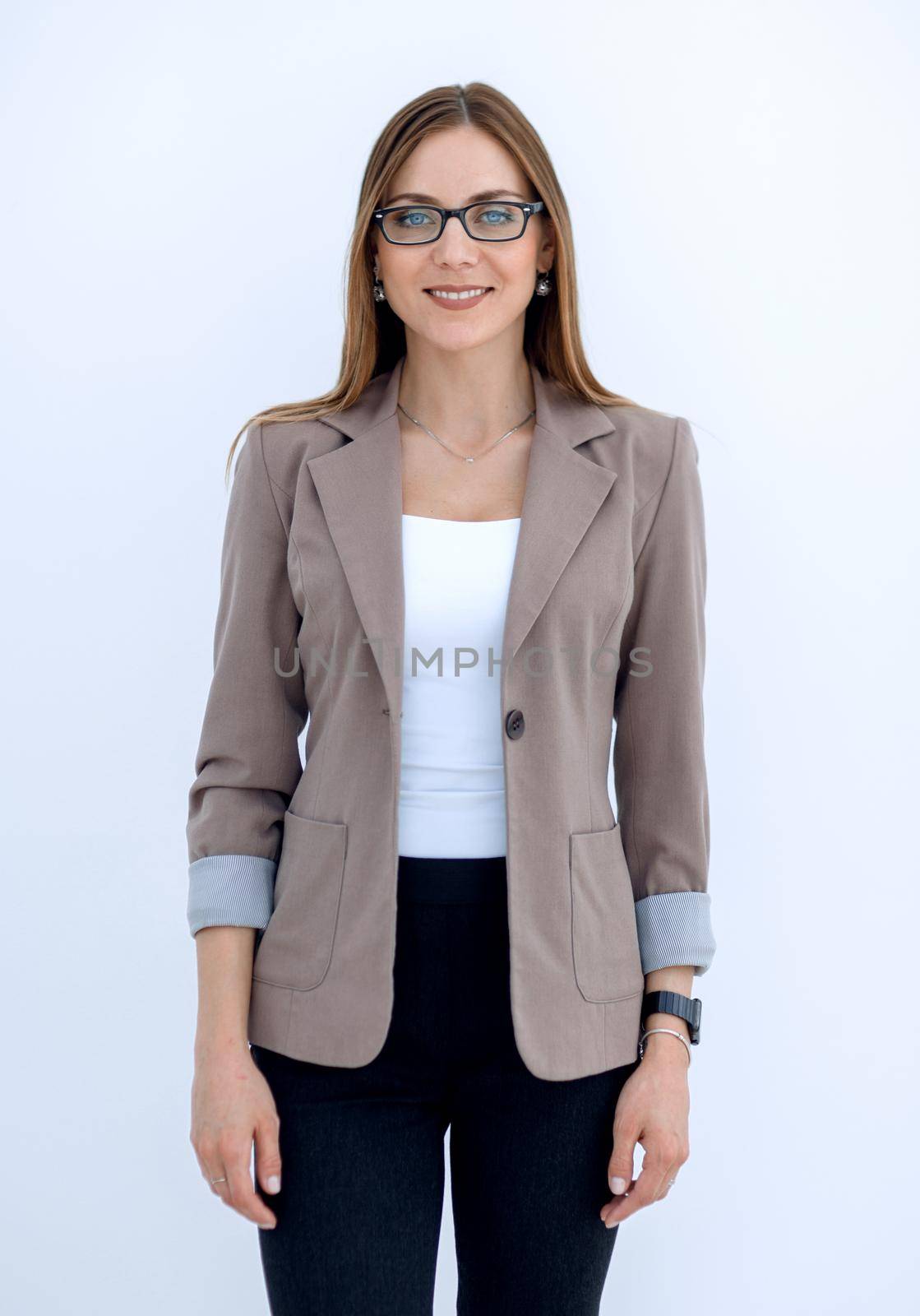 Portrait of a young woman smiling in a business suit