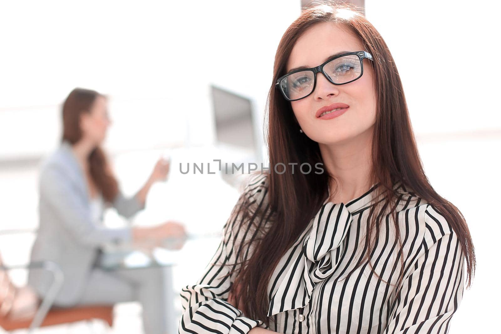 attractive business woman on the background of the office by asdf