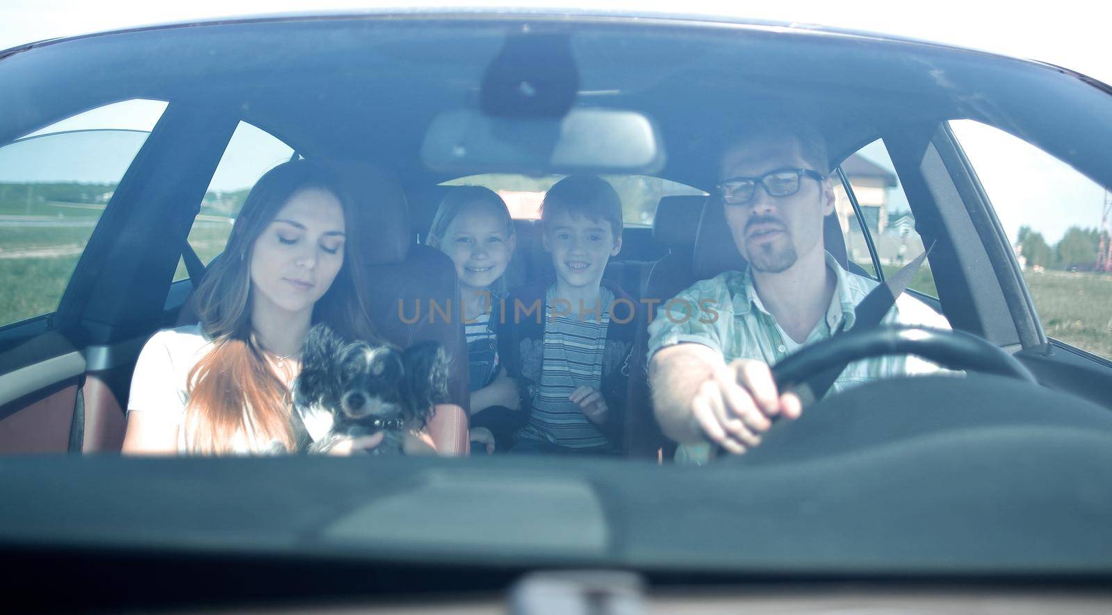 happy family travelling by car.the concept of freedom and travel