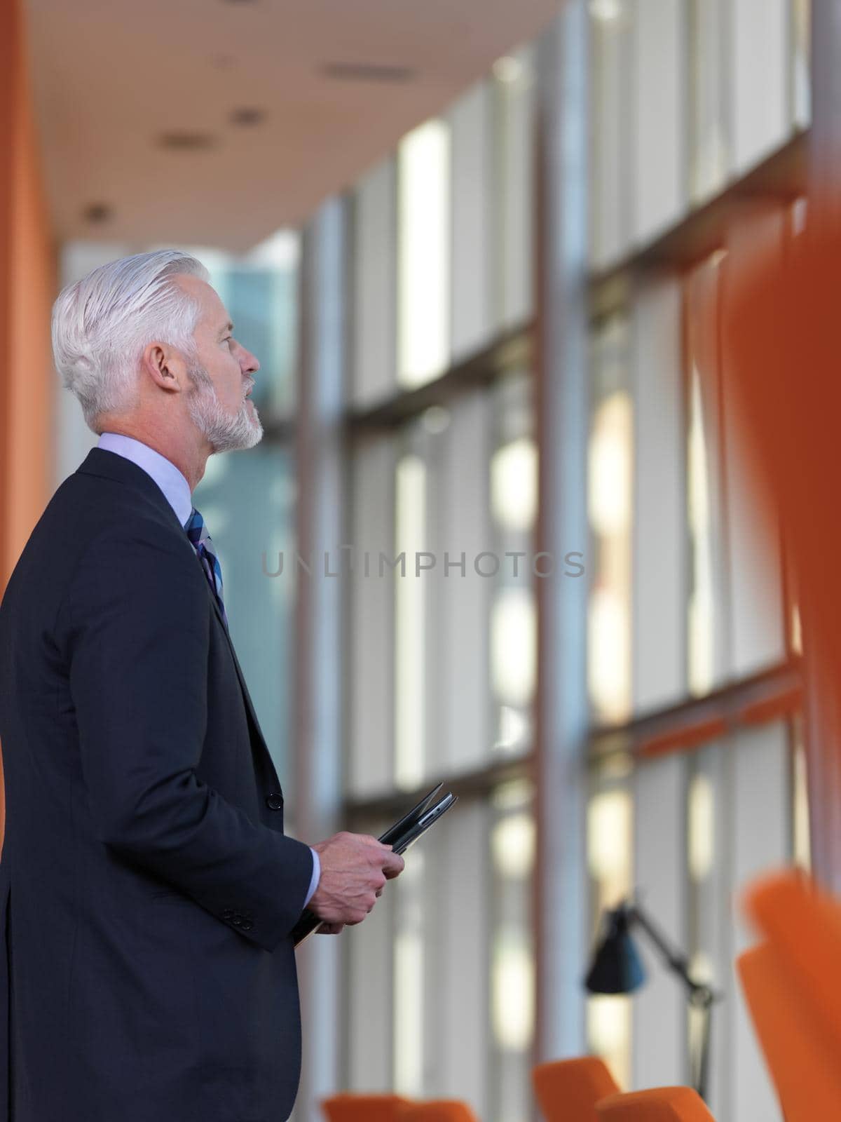 senior business man working on tablet computer at office