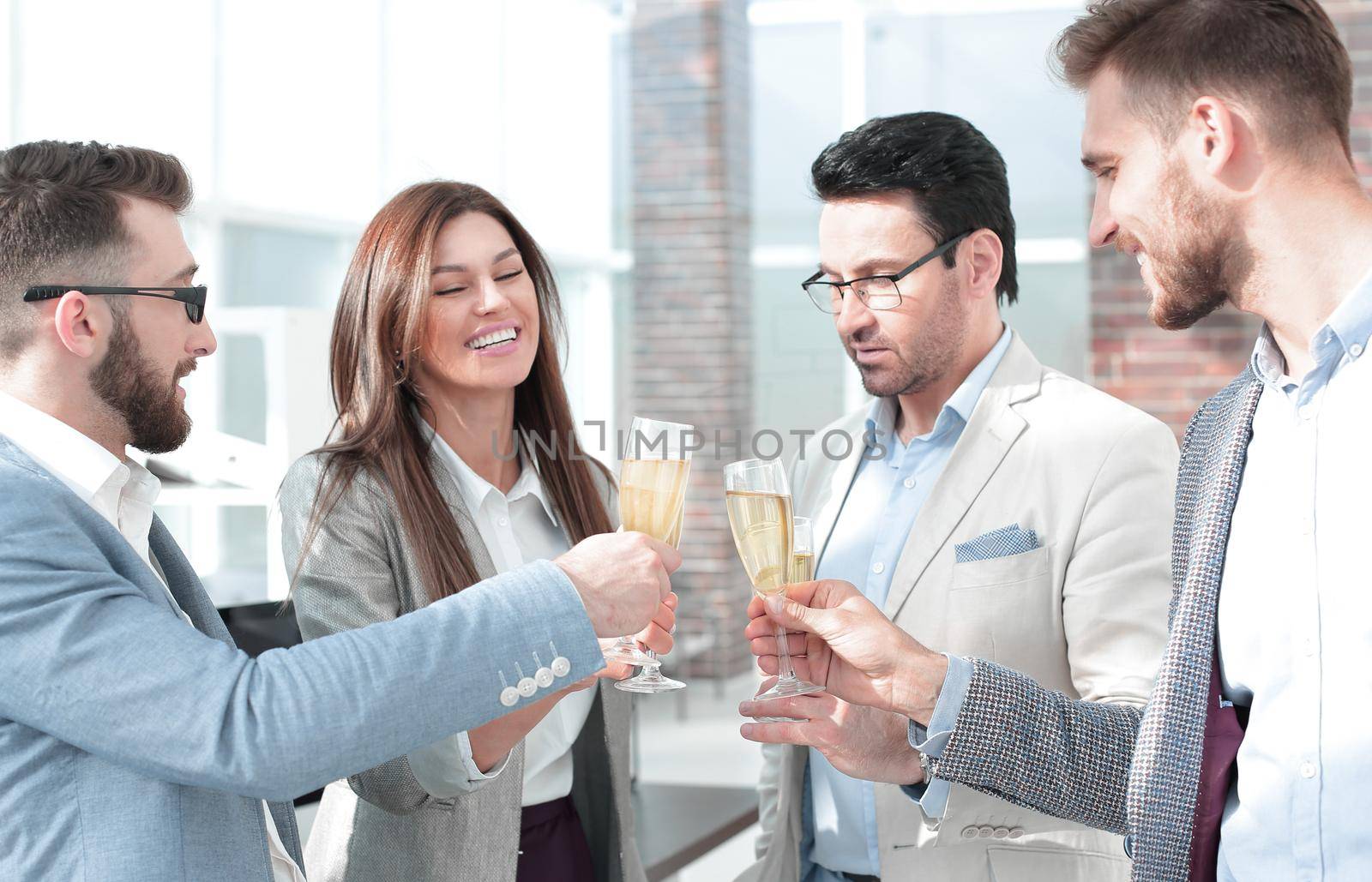 close up.business team raises their glasses.the concept of a startup